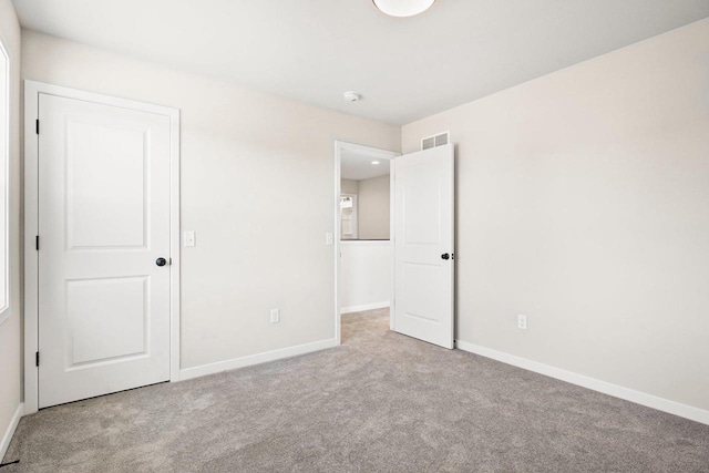 N6220 Blarney Stone Dr Unit 53, Albany, WI 53520 - unfurnished bedroom featuring carpet floors and baseboards