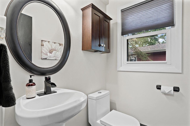 521 Maunesha Dr, Marshall, WI 53559 - half bathroom featuring a sink and toilet