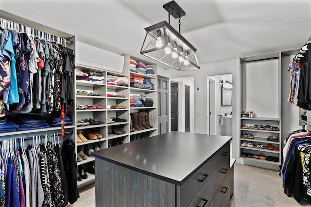 521 Maunesha Dr, Marshall, WI 53559 - spacious closet featuring light carpet and a chandelier