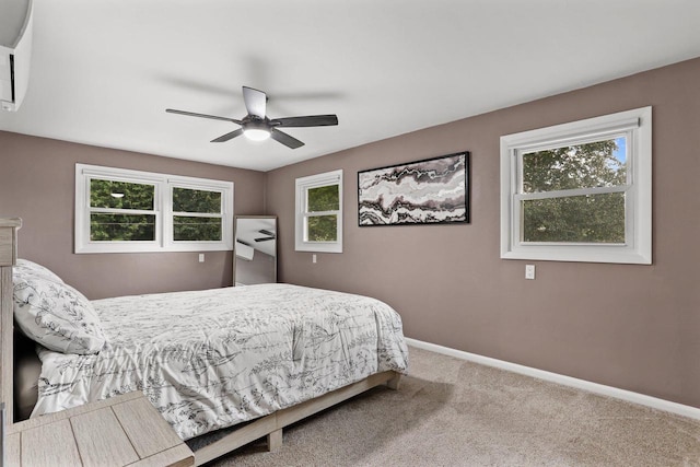 521 Maunesha Dr, Marshall, WI 53559 - carpeted bedroom with baseboards and a ceiling fan