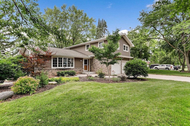 521 Maunesha Dr, Marshall, WI 53559 - split level home with an attached garage, driveway, a front lawn, and brick siding