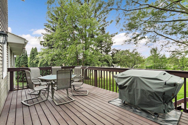 521 Maunesha Dr, Marshall, WI 53559 - wooden deck with outdoor dining area and grilling area