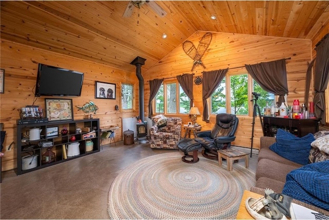1674 W White Ash Dr, Balsam Lake, WI 54810 - living area featuring wooden walls, lofted ceiling, a wood stove, healthy amount of natural light, and wood ceiling