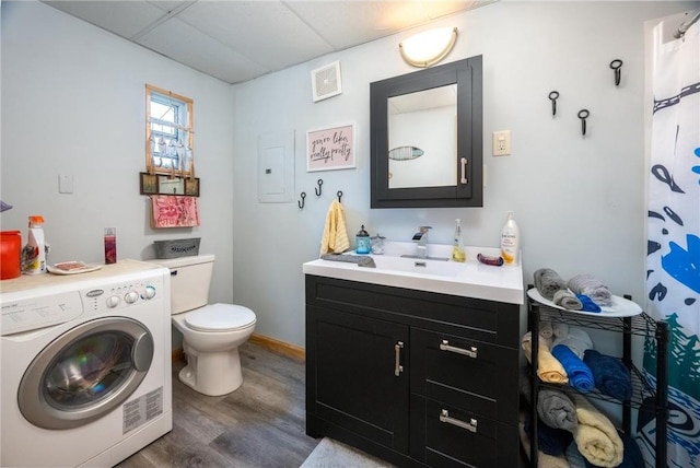 1674 W White Ash Dr, Balsam Lake, WI 54810 - washroom with washer / dryer, wood finished floors, and electric panel