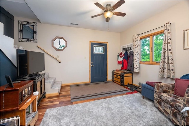 1674 W White Ash Dr, Balsam Lake, WI 54810 - entryway featuring a ceiling fan, wood finished floors, and stairs