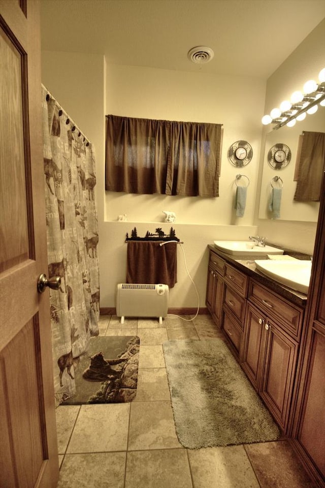 W1387 W Post Rd, Genoa City, WI 53128 - bathroom featuring double vanity and tile patterned floors