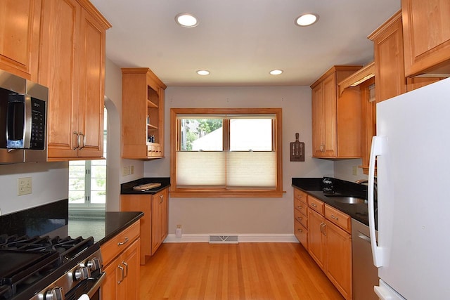 2744 N Lefeber Ave, Wauwatosa, WI 53210 - kitchen with appliances with stainless steel finishes, dark countertops, light wood-style flooring, recessed lighting, and open shelves
