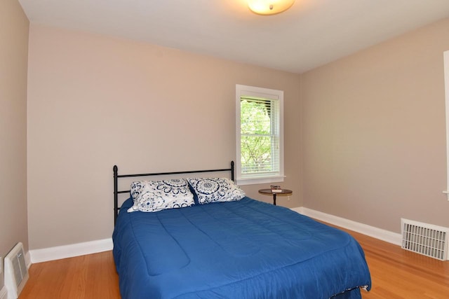 2744 N Lefeber Ave, Wauwatosa, WI 53210 - bedroom featuring wood finished floors and baseboards