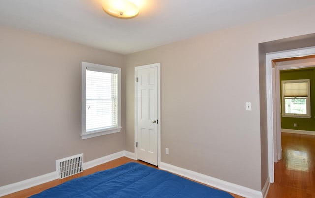 2744 N Lefeber Ave, Wauwatosa, WI 53210 - spare room featuring wood finished floors and baseboards