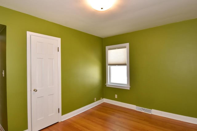 2744 N Lefeber Ave, Wauwatosa, WI 53210 - empty room with wood finished floors and baseboards