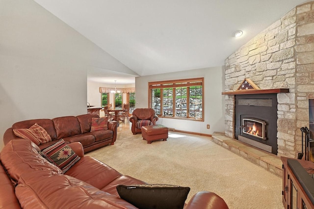 520 Bayberry Ln, Slinger, WI 53086 - living room featuring carpet, a stone fireplace, a chandelier, and high vaulted ceiling