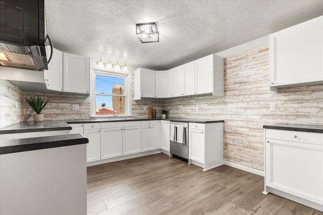 5306 Hillcrest Dr, Allenton, WI 53002 - kitchen with dishwasher, a textured ceiling, dark countertops, tasteful backsplash, and white cabinetry