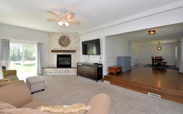 11811 213th Ave, Bristol, WI 53104 - living area with ceiling fan, a fireplace, and carpet flooring