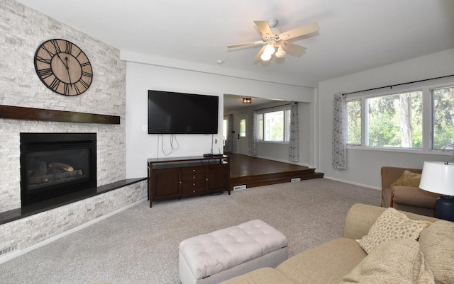 11811 213th Ave, Bristol, WI 53104 - living area featuring ceiling fan, light colored carpet, and a fireplace