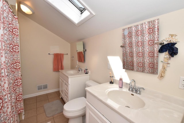 11811 213th Ave, Bristol, WI 53104 - bathroom with a skylight, vanity, lofted ceiling, and tile patterned flooring
