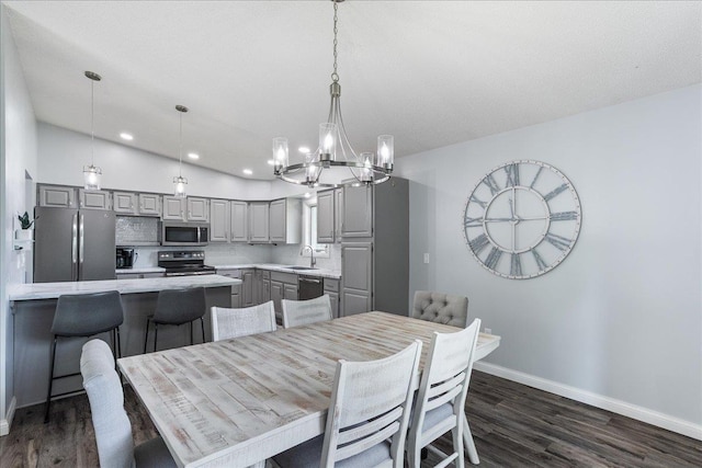 615 N Peach Ave, Marshfield, WI 54449 - dining space featuring a chandelier, dark wood finished floors, and recessed lighting