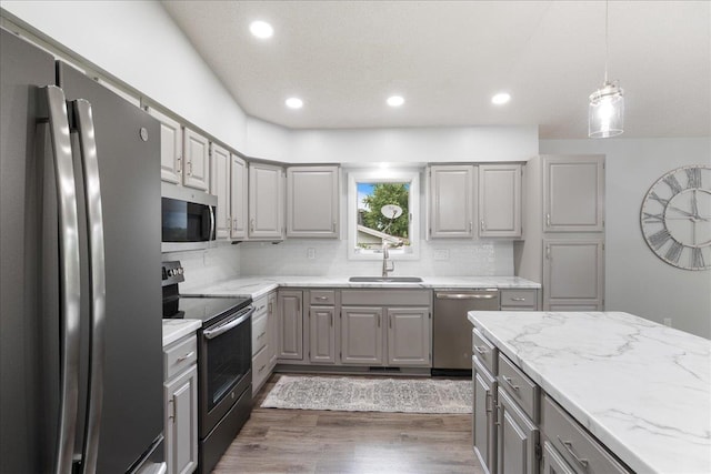 615 N Peach Ave, Marshfield, WI 54449 - kitchen with stainless steel appliances, gray cabinets, dark wood-type flooring, recessed lighting, and backsplash