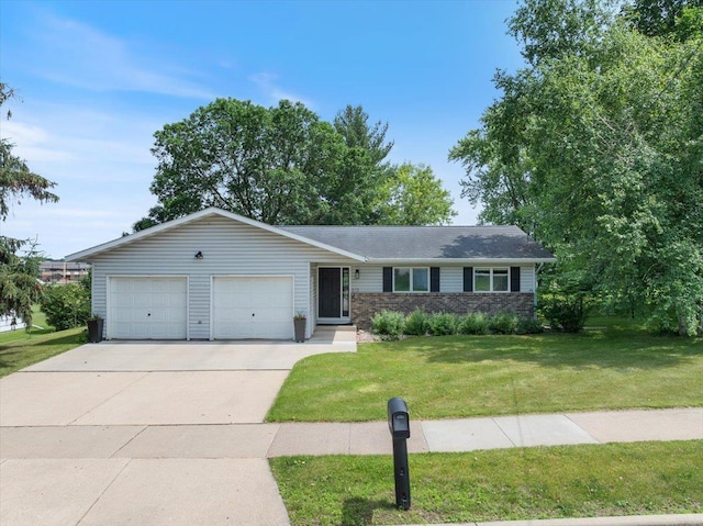 615 N Peach Ave, Marshfield, WI 54449 - ranch-style home featuring a front yard, an attached garage, and driveway