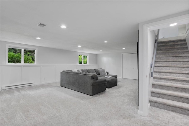 615 N Peach Ave, Marshfield, WI 54449 - living area featuring a baseboard radiator, carpet flooring, stairway, and recessed lighting