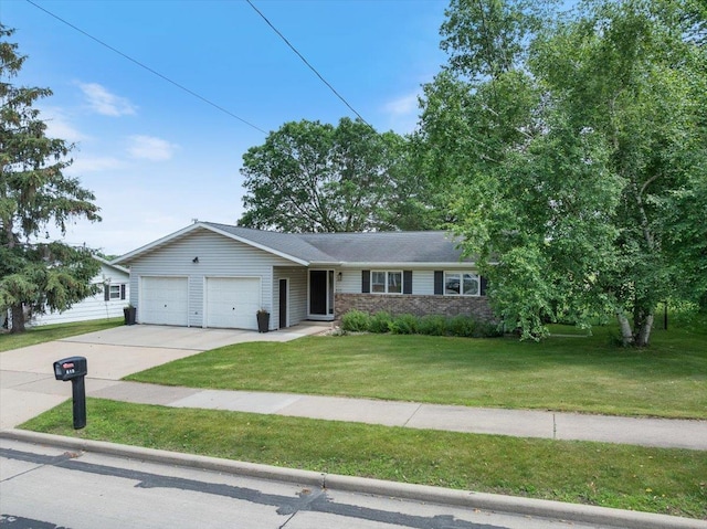 615 N Peach Ave, Marshfield, WI 54449 - ranch-style house with a garage, driveway, and a front yard