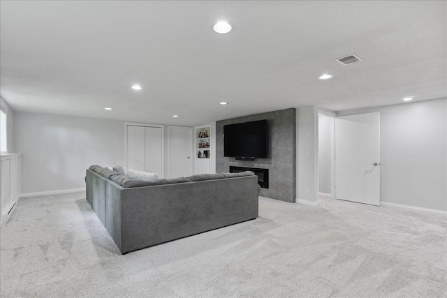 615 N Peach Ave, Marshfield, WI 54449 - living room with light colored carpet, recessed lighting, and a fireplace