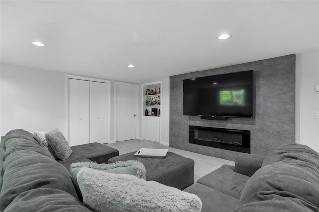 615 N Peach Ave, Marshfield, WI 54449 - living room featuring built in features, recessed lighting, carpet, and a large fireplace