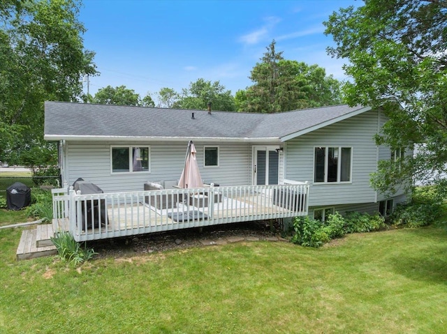 615 N Peach Ave, Marshfield, WI 54449 - rear view of house featuring a yard, a wooden deck, and a shingled roof