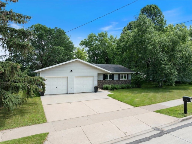 615 N Peach Ave, Marshfield, WI 54449 - ranch-style house featuring a front lawn, concrete driveway, and an attached garage