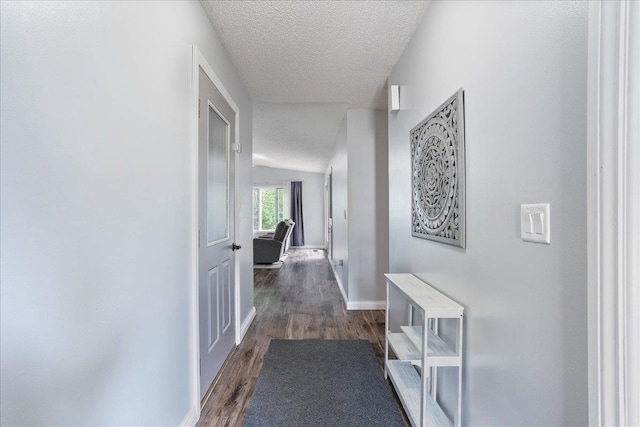 615 N Peach Ave, Marshfield, WI 54449 - corridor with a textured ceiling and wood finished floors