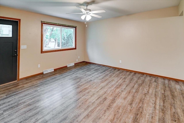 5716 Sauk Ln, Mcfarland, WI 53558 - unfurnished room with plenty of natural light, wood finished floors, and ceiling fan