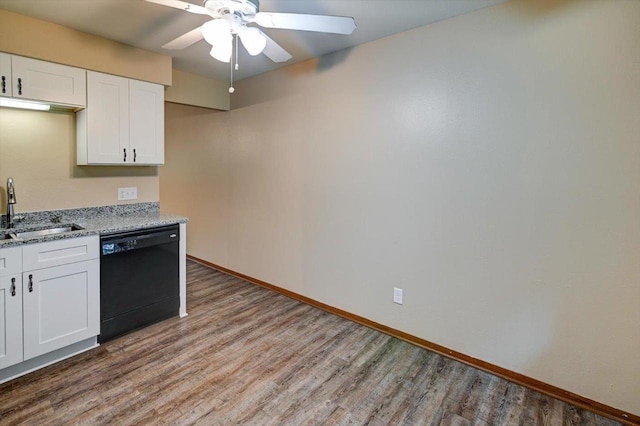 5716 Sauk Ln, Mcfarland, WI 53558 - kitchen featuring dishwasher, wood finished floors, light stone countertops, white cabinets, and a ceiling fan