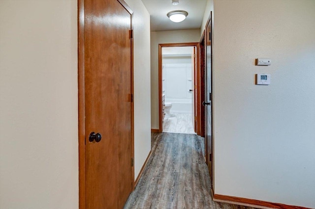 5716 Sauk Ln, Mcfarland, WI 53558 - hallway with wood finished floors and baseboards