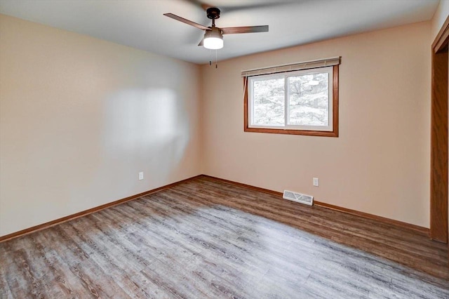 5716 Sauk Ln, Mcfarland, WI 53558 - unfurnished room with wood finished floors and a ceiling fan