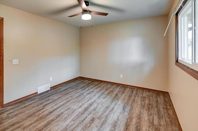 5716 Sauk Ln, Mcfarland, WI 53558 - unfurnished room featuring wood finished floors and a ceiling fan
