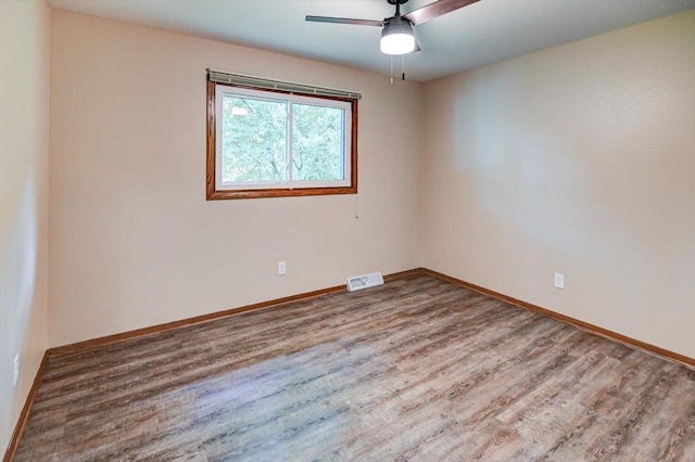 5716 Sauk Ln, Mcfarland, WI 53558 - unfurnished room featuring wood finished floors and a ceiling fan