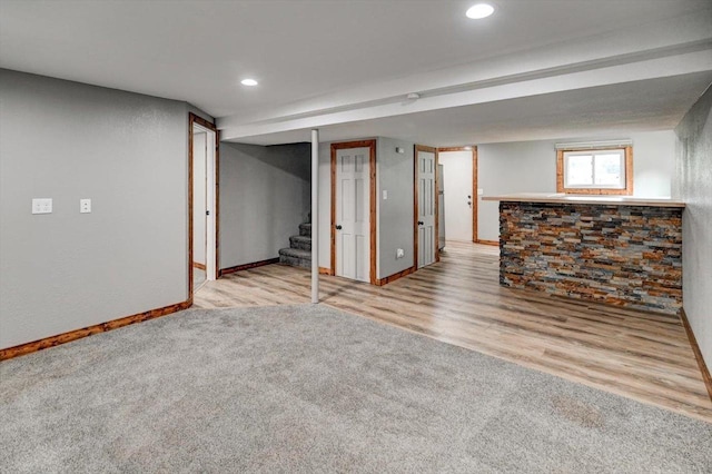 5716 Sauk Ln, Mcfarland, WI 53558 - below grade area with stairway, recessed lighting, carpet flooring, and wood finished floors