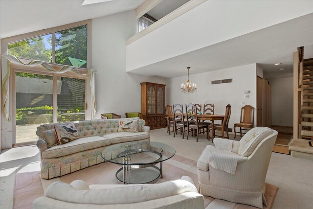 36 Stonewood Ct Unit 36, Wind Point, WI 53402 - carpeted living area with a chandelier and high vaulted ceiling