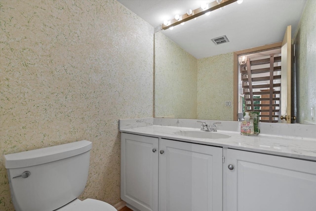 36 Stonewood Ct Unit 36, Wind Point, WI 53402 - bathroom with vanity and wallpapered walls