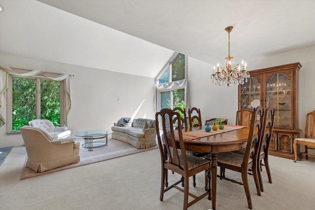 36 Stonewood Ct Unit 36, Wind Point, WI 53402 - dining area featuring light colored carpet, a chandelier, and vaulted ceiling