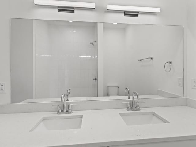 9352 S Alder Pl Unit 105, Oak Creek, WI 53154 - bathroom featuring double vanity and tiled shower