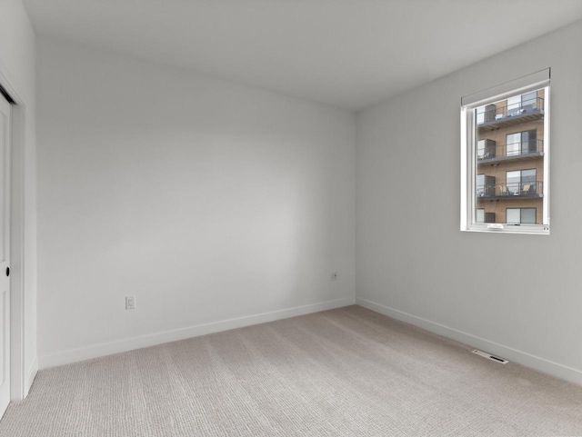 9352 S Alder Pl Unit 105, Oak Creek, WI 53154 - spare room with light carpet and baseboards