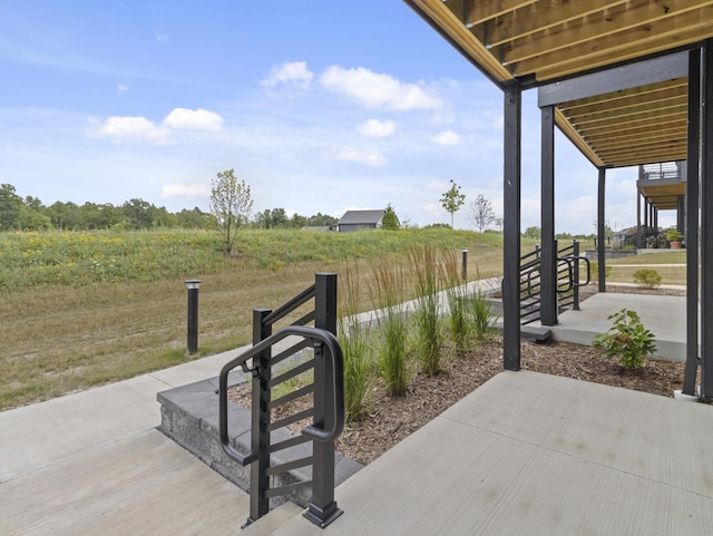 9352 S Alder Pl Unit 105, Oak Creek, WI 53154 - view of patio featuring a view of countryside