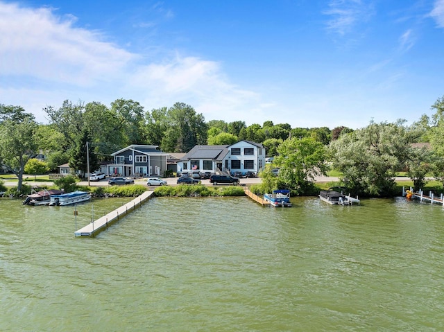 N3245 Walnut Rd, Lake Geneva, WI 53147 - dock with a water view and view of wooded area