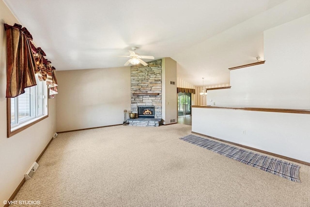 911 Park Cir, Union Grove, WI 53182 - unfurnished living room featuring ceiling fan, carpet, plenty of natural light, and vaulted ceiling