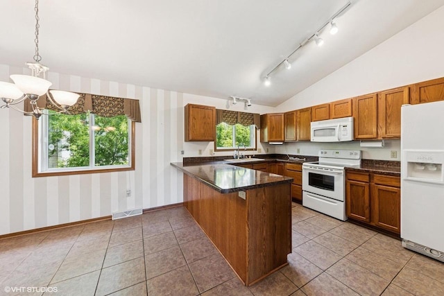 911 Park Cir, Union Grove, WI 53182 - kitchen featuring white appliances, a peninsula, track lighting, wallpapered walls, and brown cabinetry
