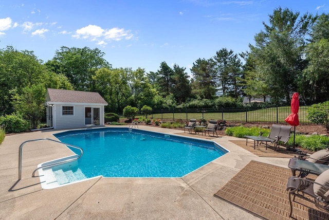 1948 Field Cliffe Dr, Richfield, WI 53076 - view of pool with a patio area, an outdoor structure, a storage structure, and view of scattered trees