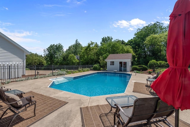 1948 Field Cliffe Dr, Richfield, WI 53076 - view of swimming pool featuring a patio, an outbuilding, and view of scattered trees