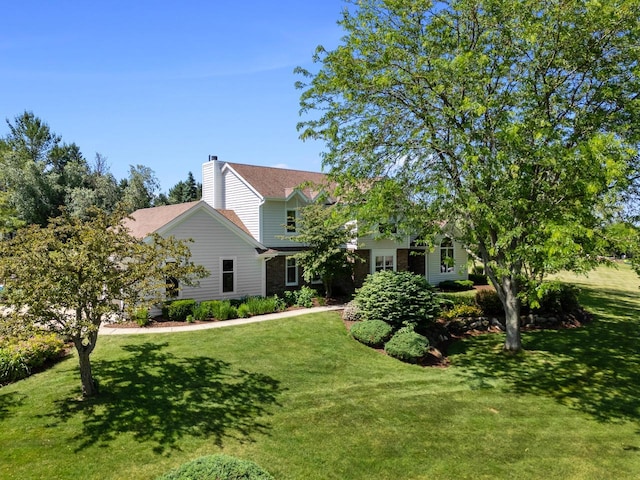 1948 Field Cliffe Dr, Richfield, WI 53076 - view of front of house featuring a front yard and a chimney