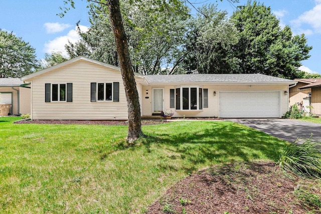 2806 Mckenna Blvd, Madison, WI 53719 - ranch-style home featuring asphalt driveway, a garage, and a front yard