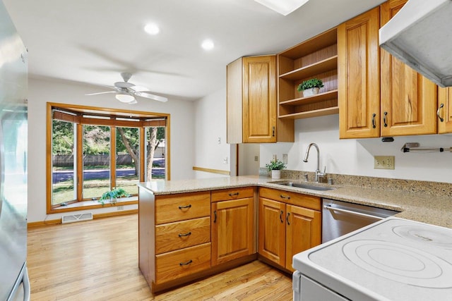 2806 Mckenna Blvd, Madison, WI 53719 - kitchen featuring open shelves, extractor fan, range, light wood finished floors, and a peninsula